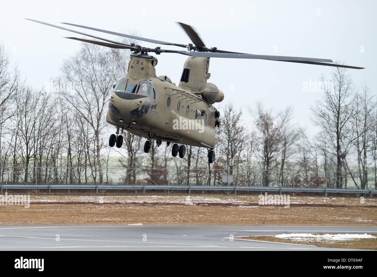 Grafenwoehr, Germany. 10th Feb, 2014. A Boeing CH-47 Chinook helicopter approaches for landing at the training area in Grafenwoehr, Germany, 10 February 2014. About 350 soldiers jumped from about 330 meters above sea level from a military helicopter. The training prepares the 173rd Airborne Brigade for further operations. The unit has already been employed in the war zones in Iraq and Afghanistan. Photo: ARMIN WEIGEL/dpa/Alamy Live News Stock Photo