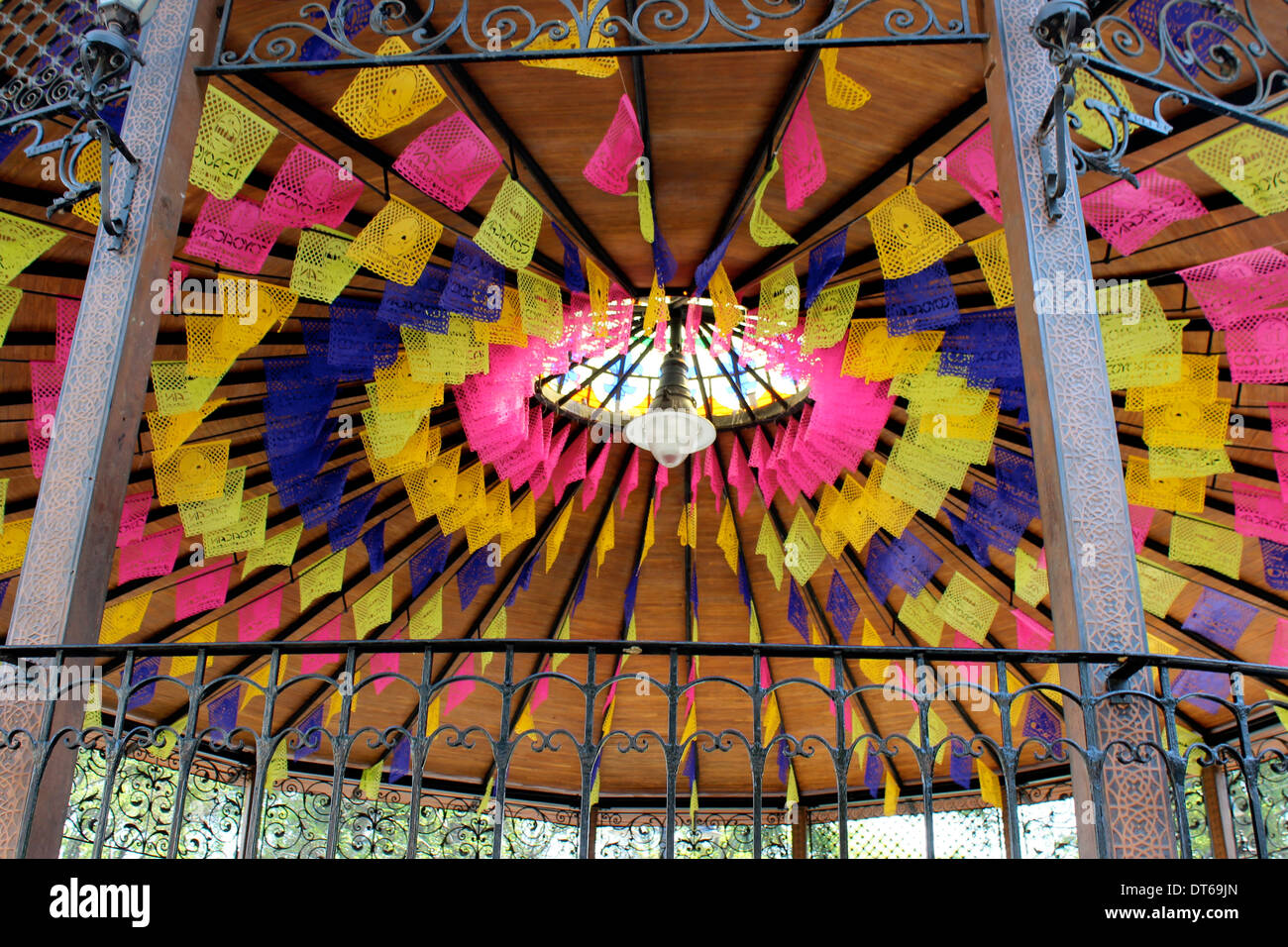 Colourful paper flags in the kiosko or band stand in the main square, Coyoacan, Mexico City Stock Photo