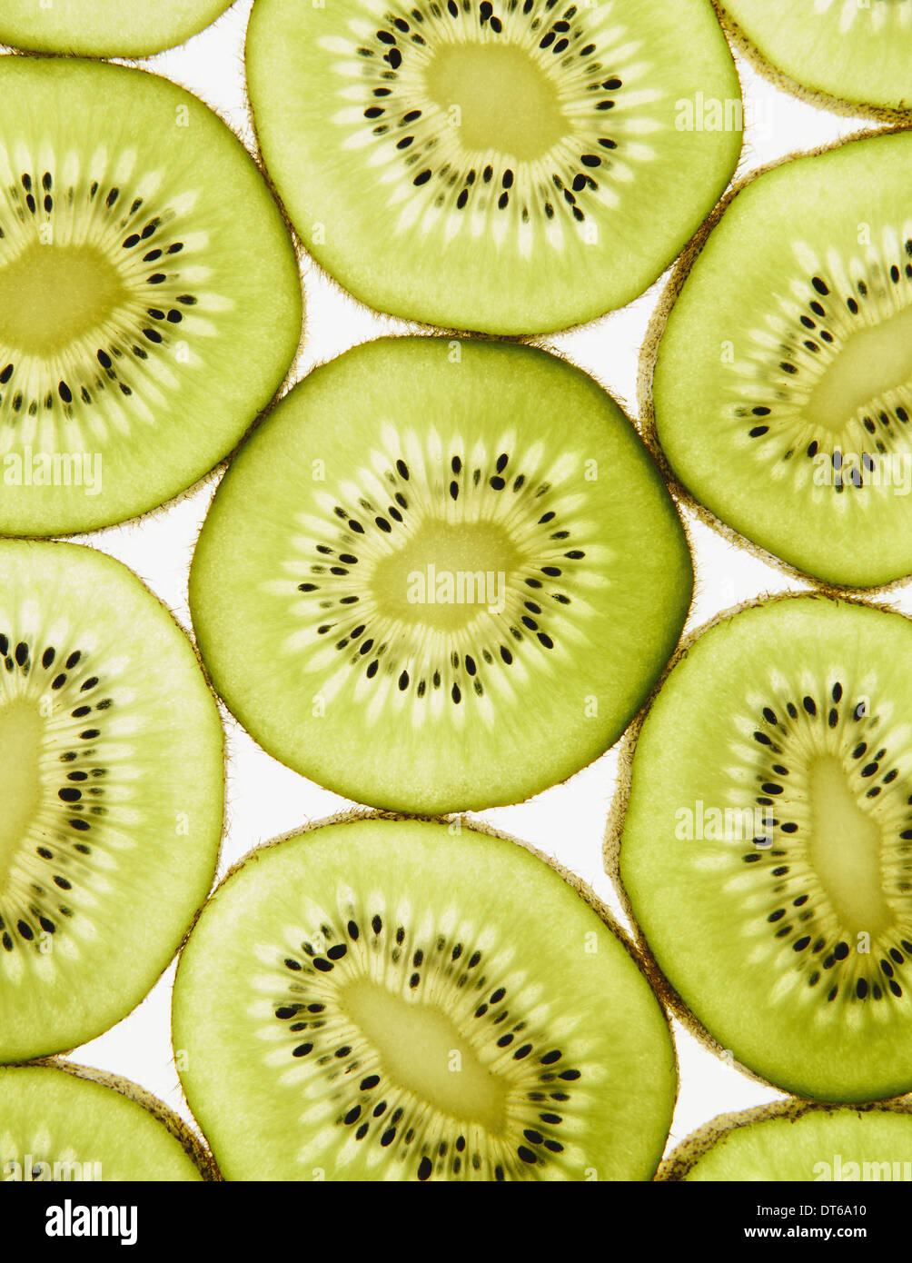 Organic kiwi slices, white background Stock Photo