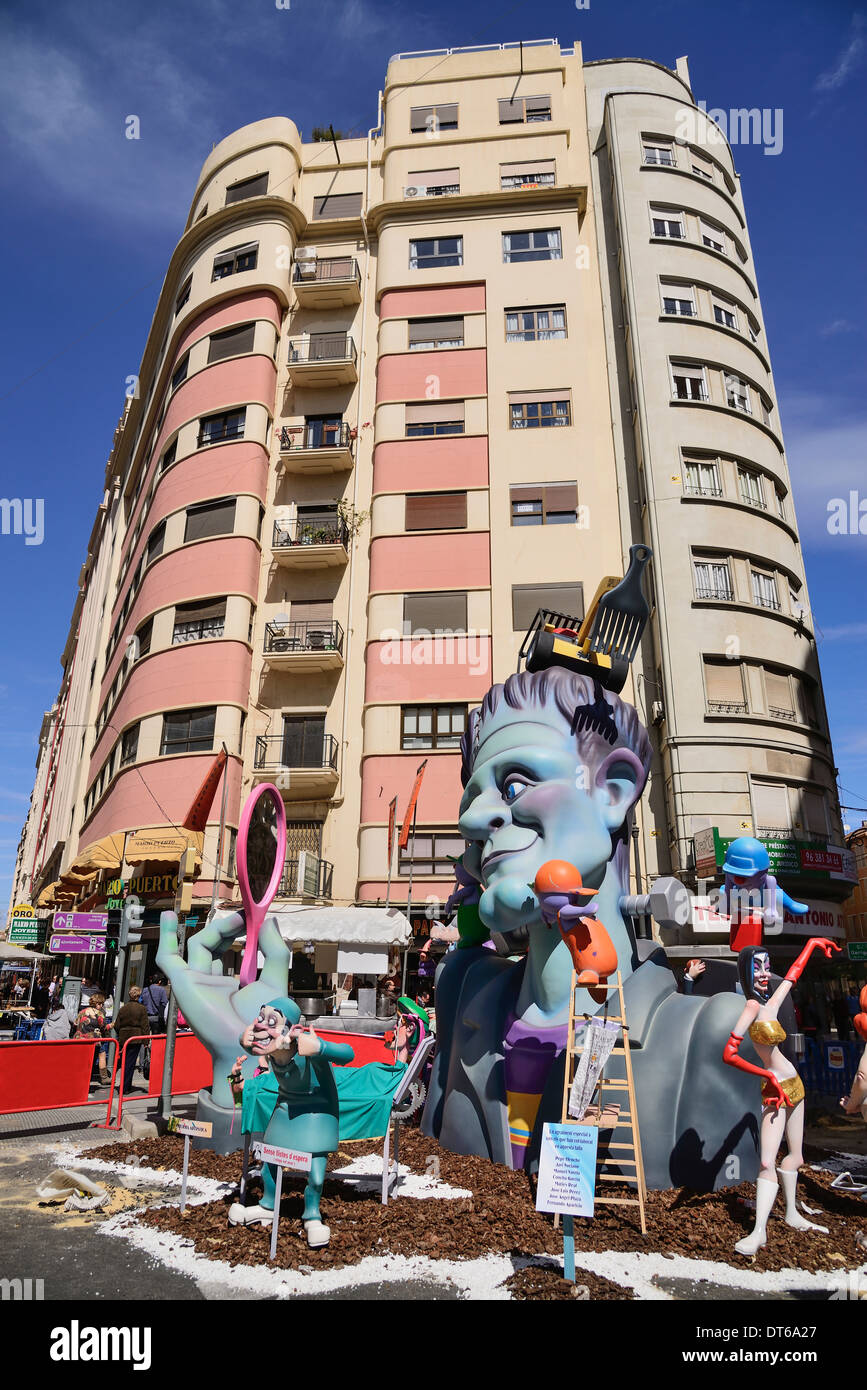 Spain, Valencia Province, Valencia,Typical falla scene with papier mache figures in the street during Las Fallas festival. Stock Photo