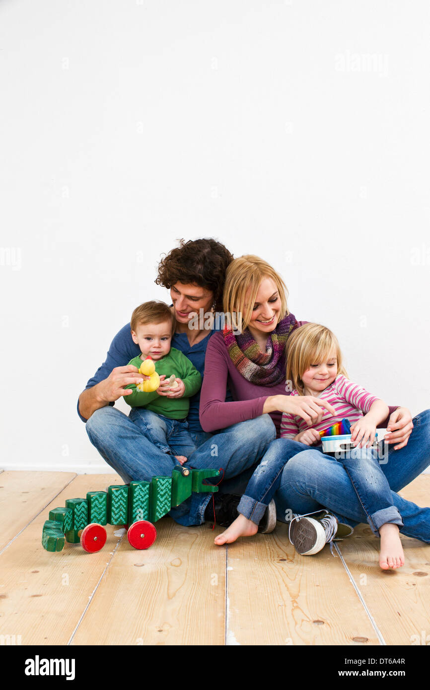 Studio shot of couple with two young daughters Stock Photo