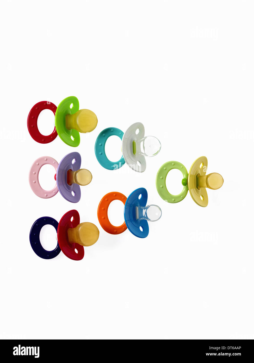 Coloured plastic baby pacifiers, dummies or soothers. Stock Photo