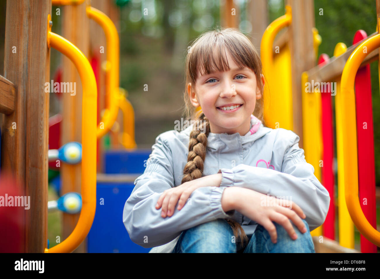 Cute little girl on the playground in spring day Stock Photo - Alamy