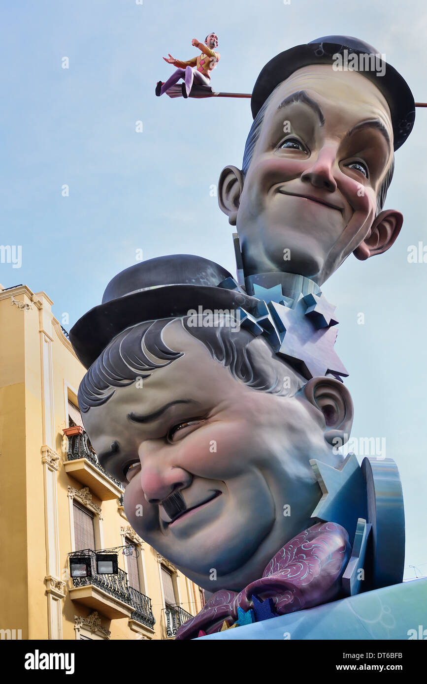 Spain, Valencia Province, Valencia, Papier Mache versions of Laurel and Hardy in the street during Las Fallas festival. Stock Photo