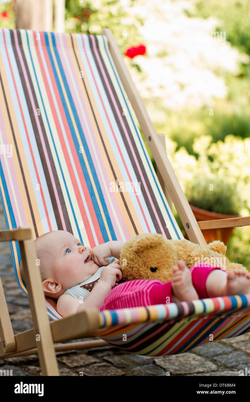 Young girl sitting on chair hires stock photography and images Alamy