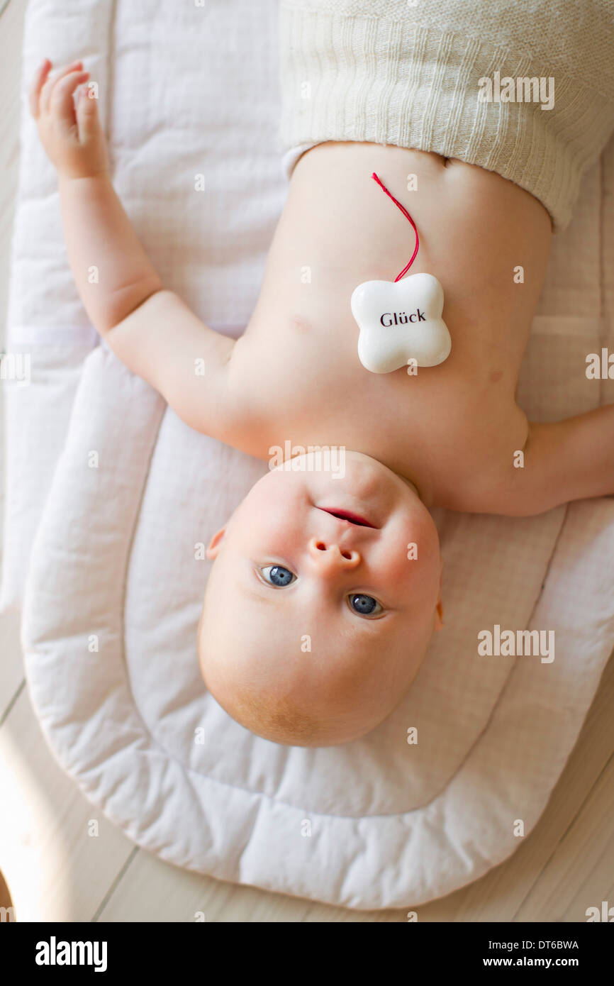 Baby girl with lucky charm Stock Photo Alamy