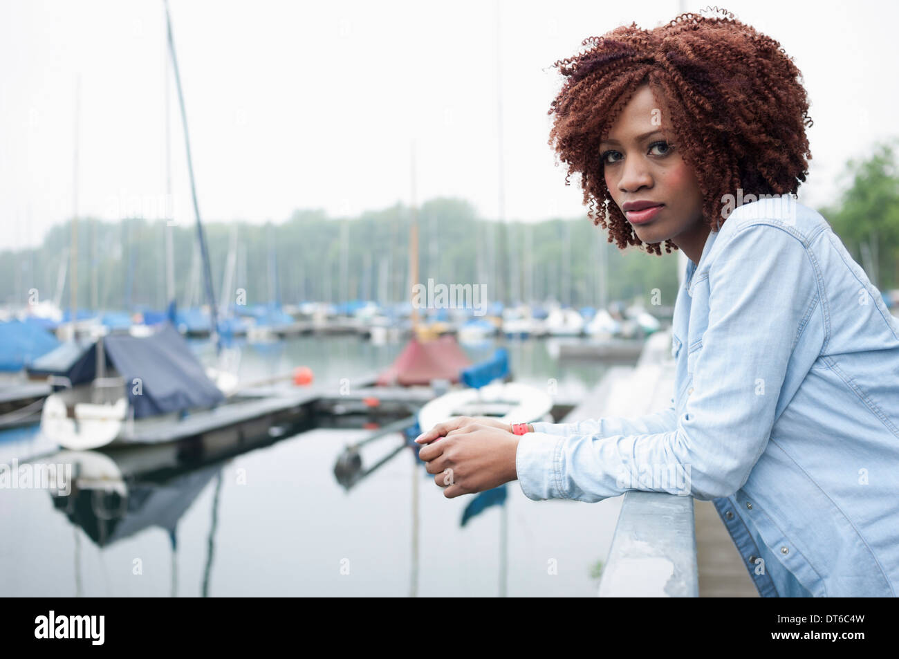 Portrait of young woman in marina Stock Photo
