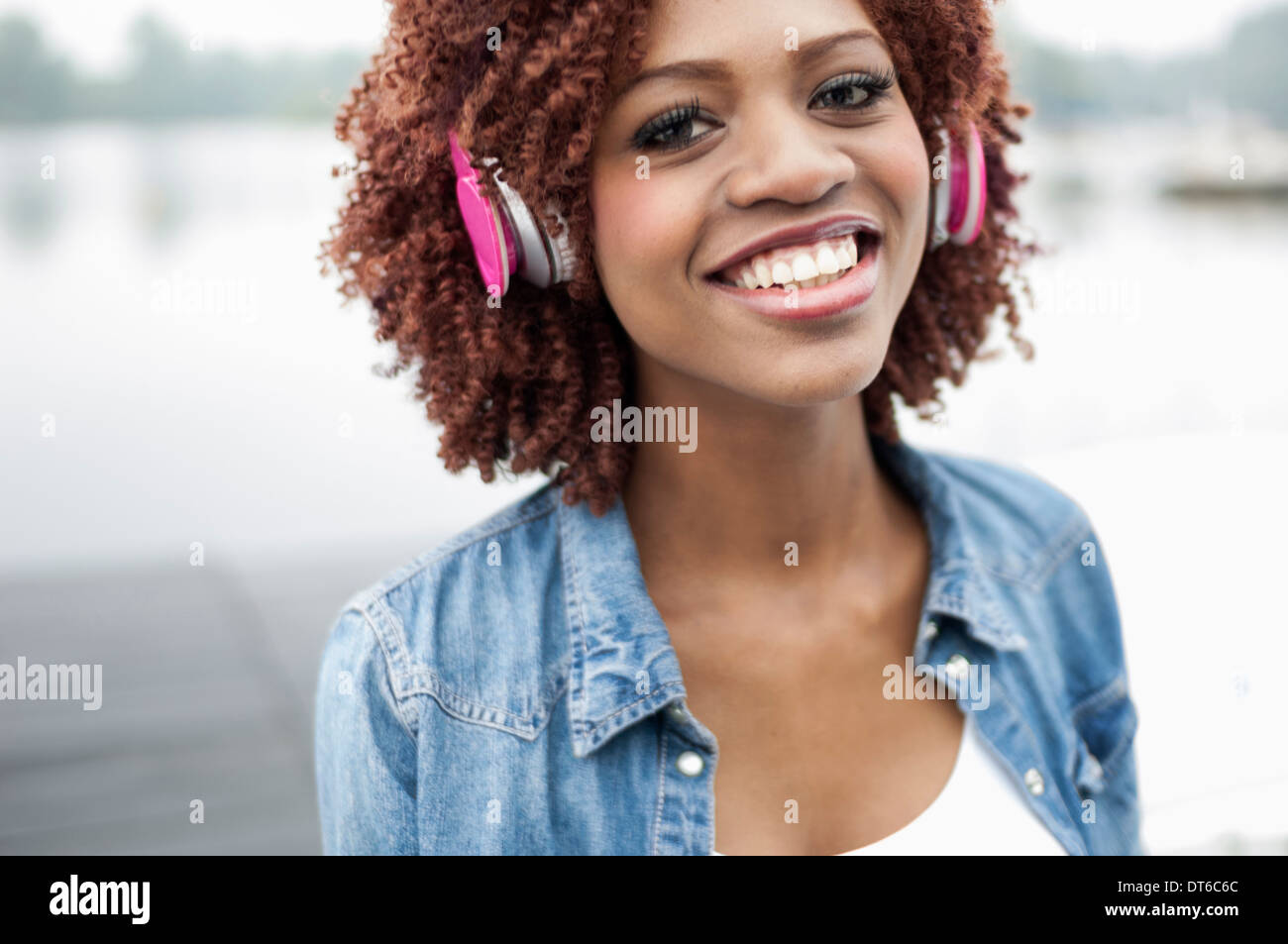 Portrait of young woman wearing headphones Stock Photo