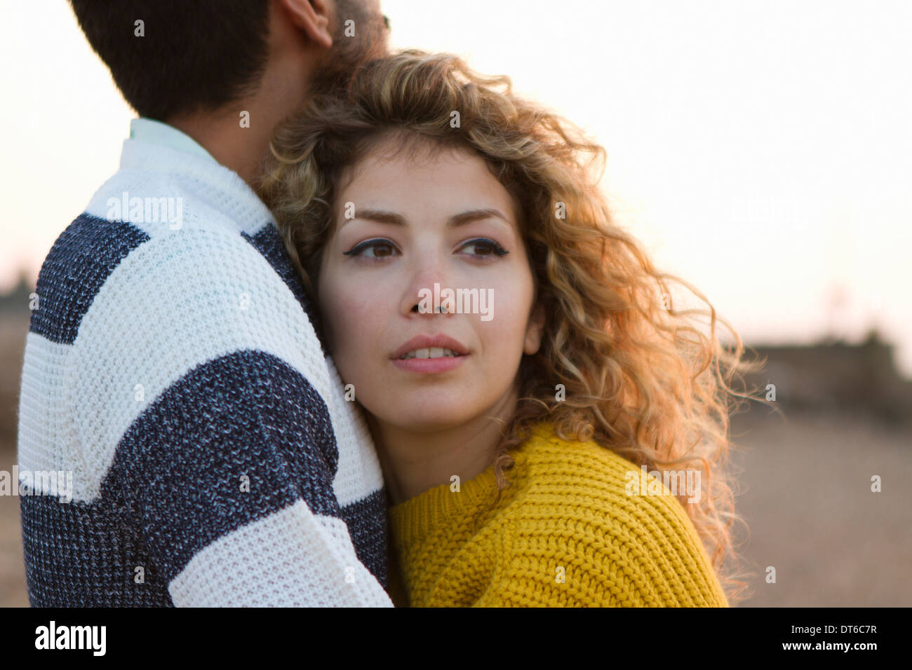 Young couple hugging on beach Stock Photo