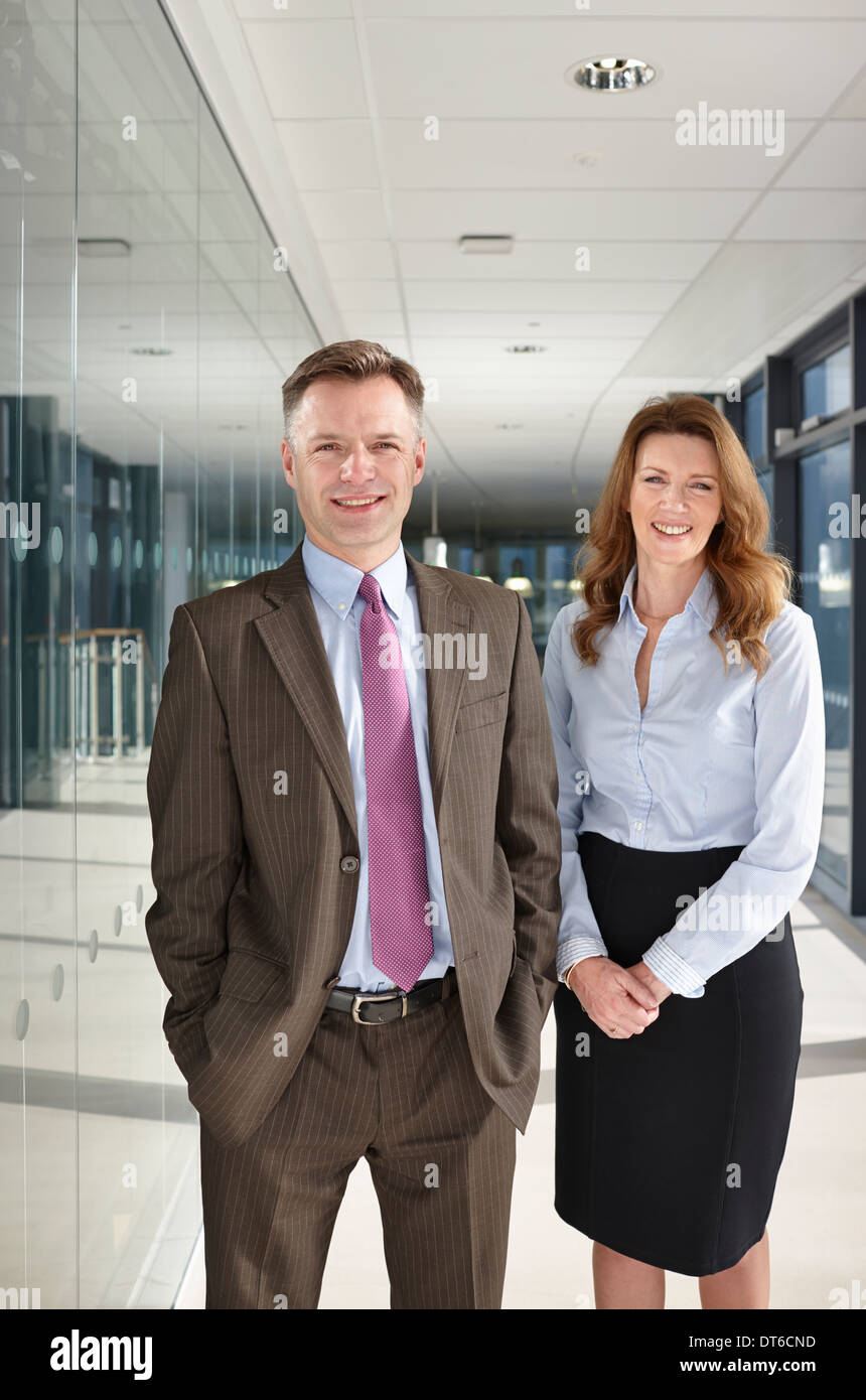 Portrait of business colleagues in corridor Stock Photo - Alamy