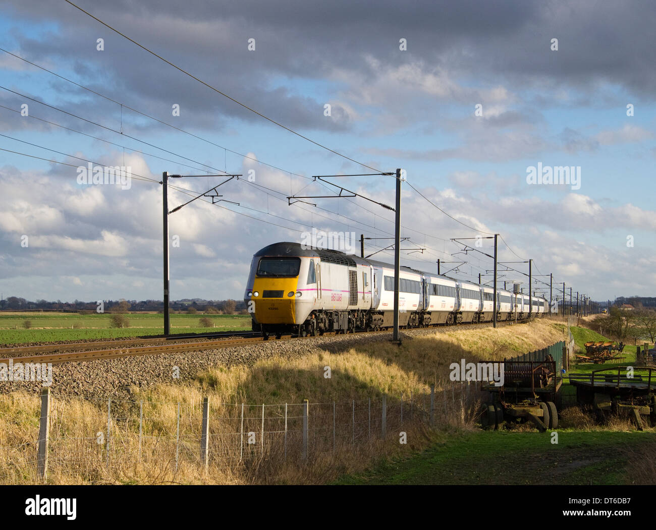 With a service from London Kings Cross a East Coast Trains service races north to Aberdeen at Balderton, Nottinghamshire. Stock Photo