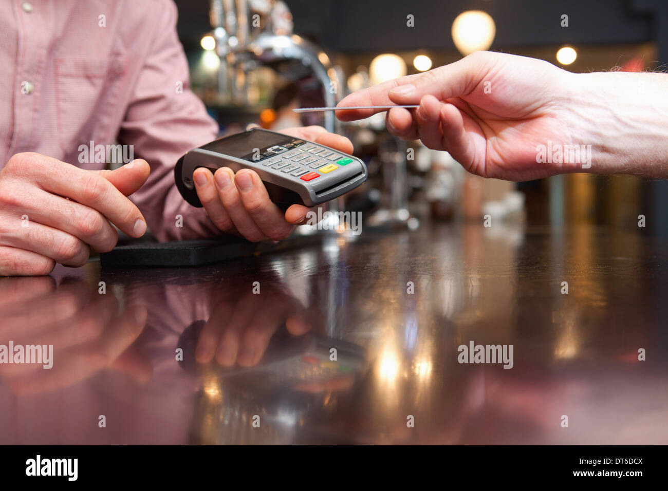 Paying bill by credit card Stock Photo