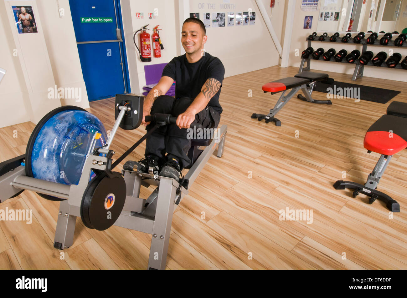 Man in occupational gym with female instructor Stock Photo - Alamy