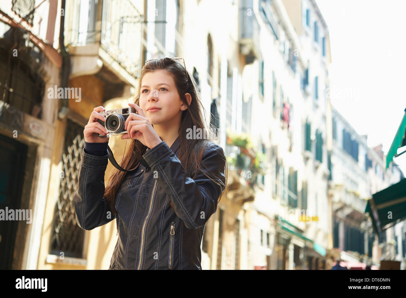 Girl exploring with camera, Venice, Italy Stock Photo
