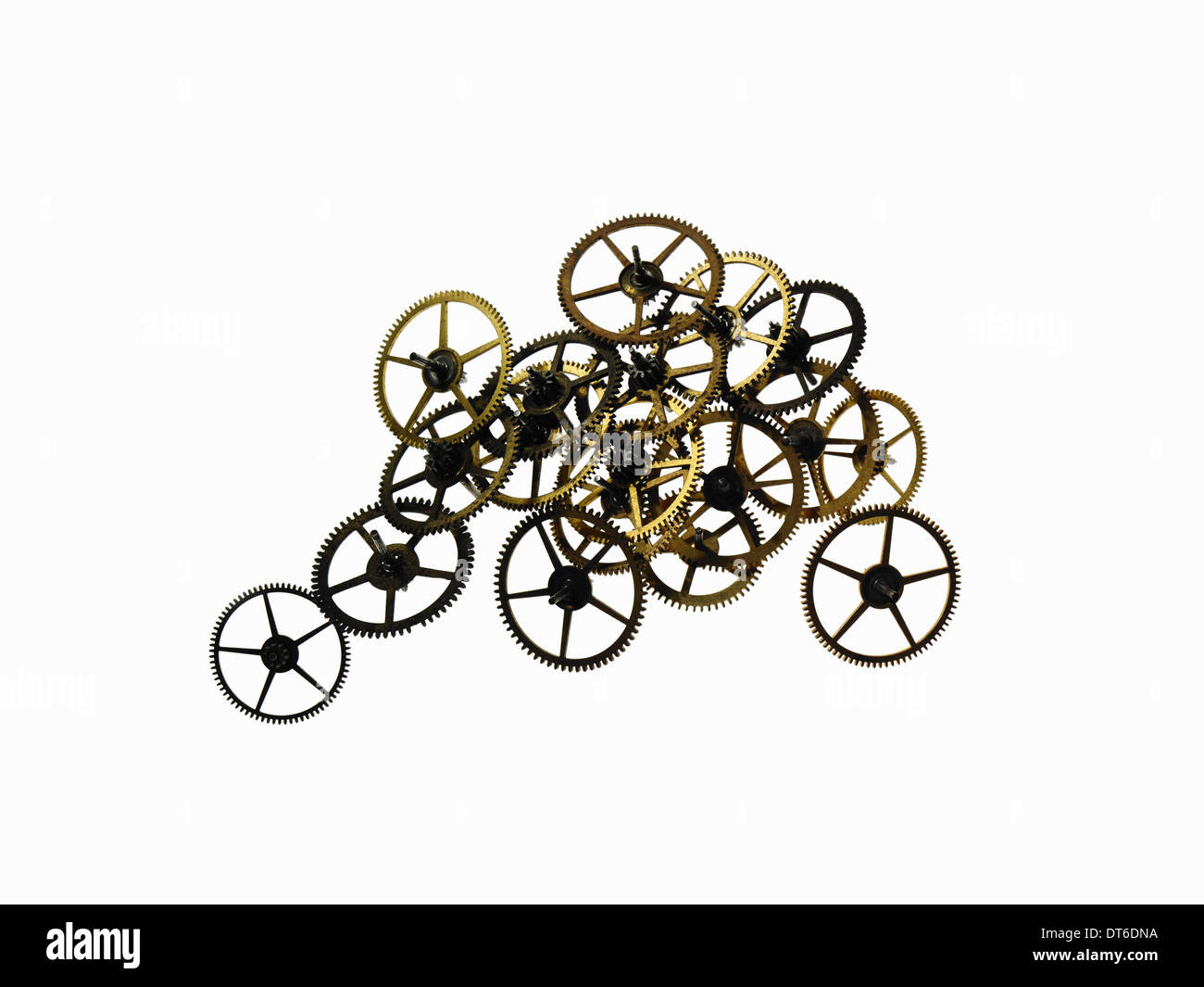 Watch gears, small precision made cog wheels with spokes and fine teeth or notches around the edge. Arranged in a pile. Stock Photo