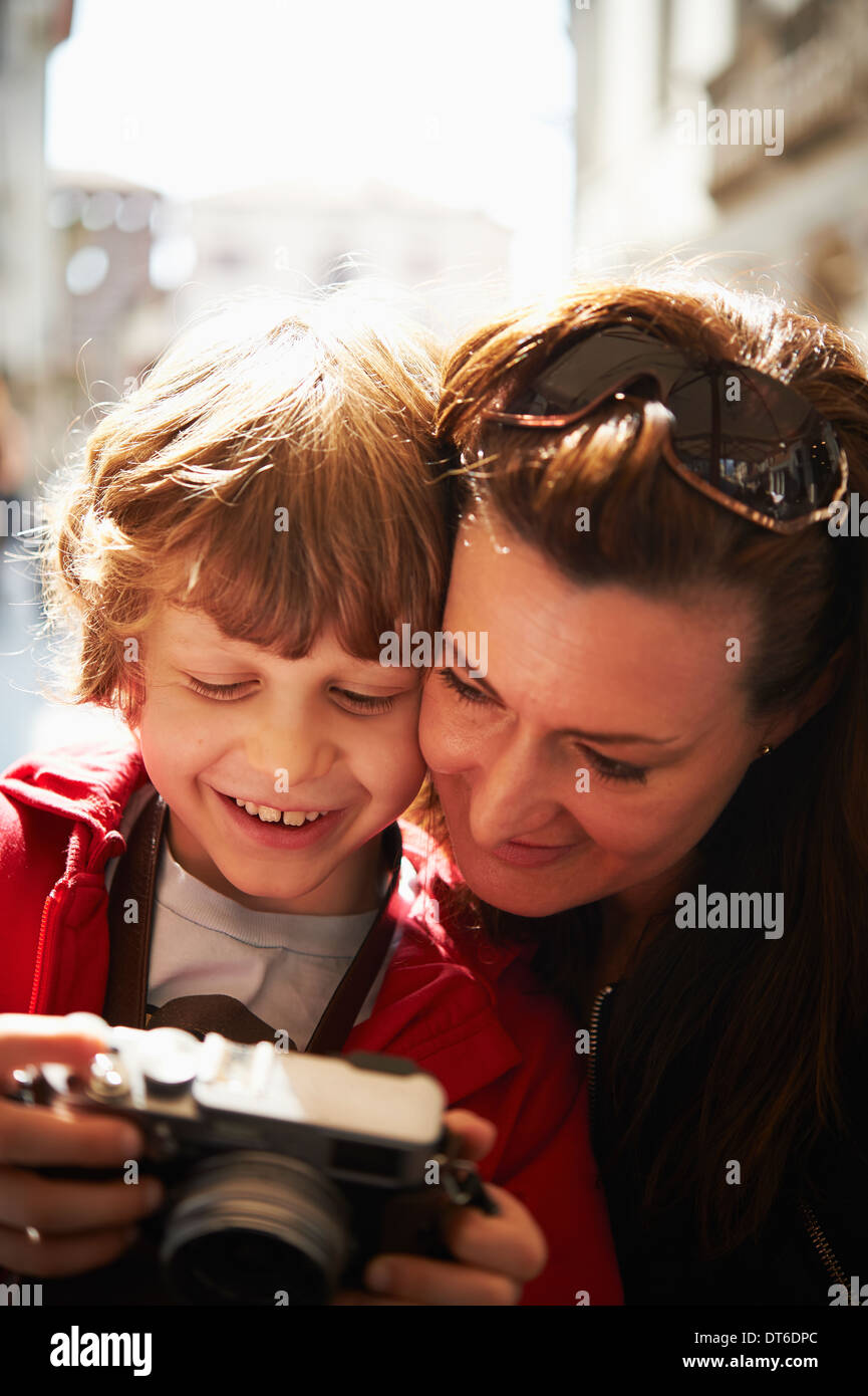 Mother and son checking photographs on camera Stock Photo