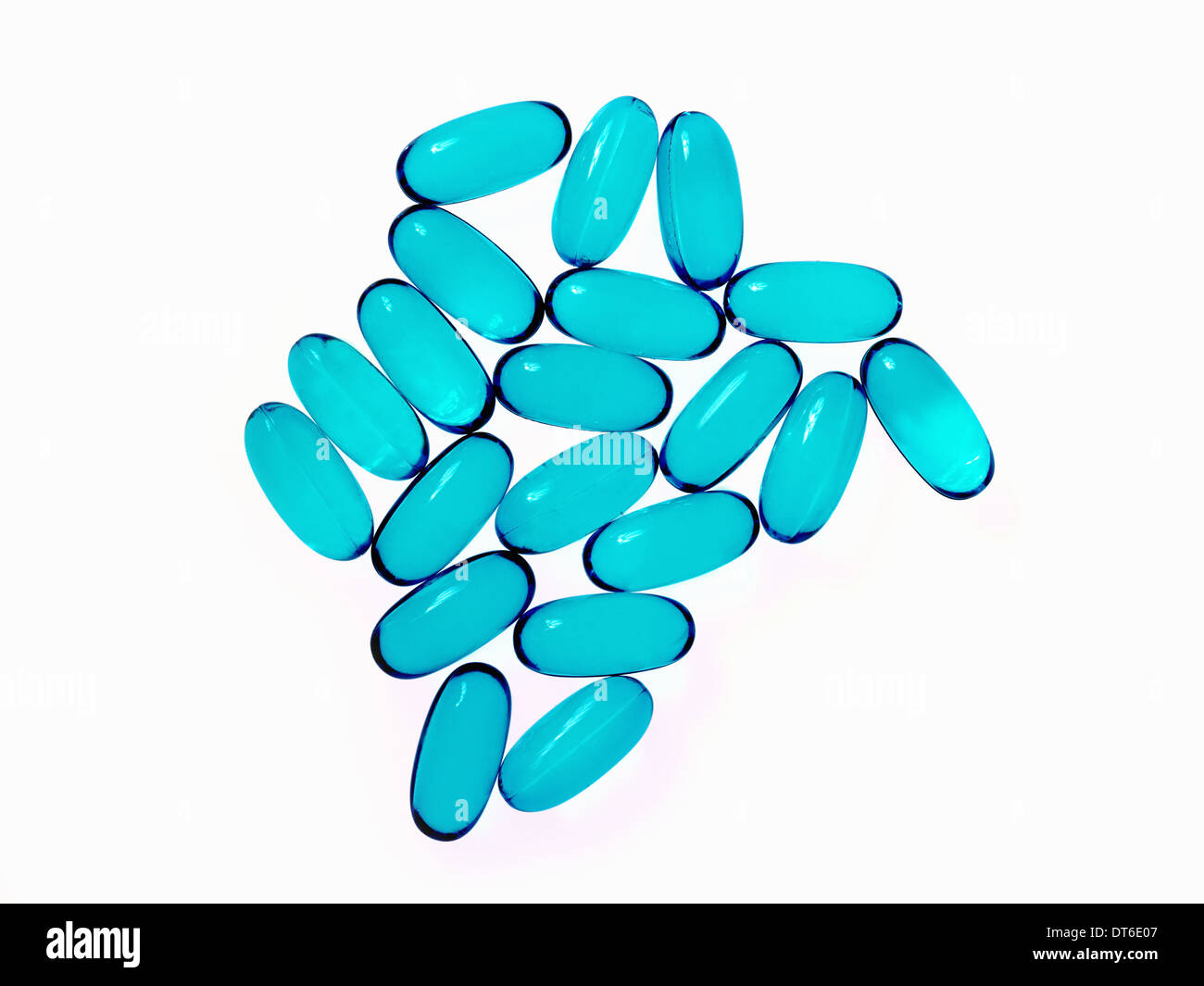 Blue oblong gel pill capsules. Arranged in a pattern. Stock Photo