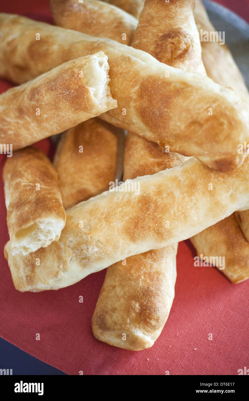 A buffet table laid out for a party. Organic food. Fresh bread, breadsticks. Stock Photo
