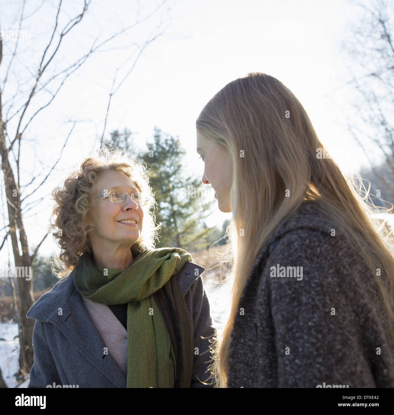 Two women outdoors wearing warm clothes against the cold. Mother and daughter. Stock Photo