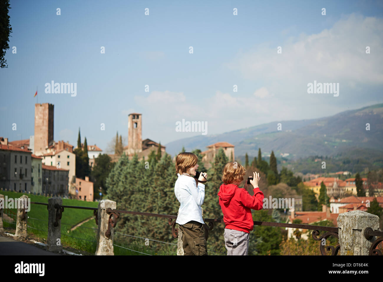 Young brothers photographing from park, Province of Venice, Italy Stock Photo