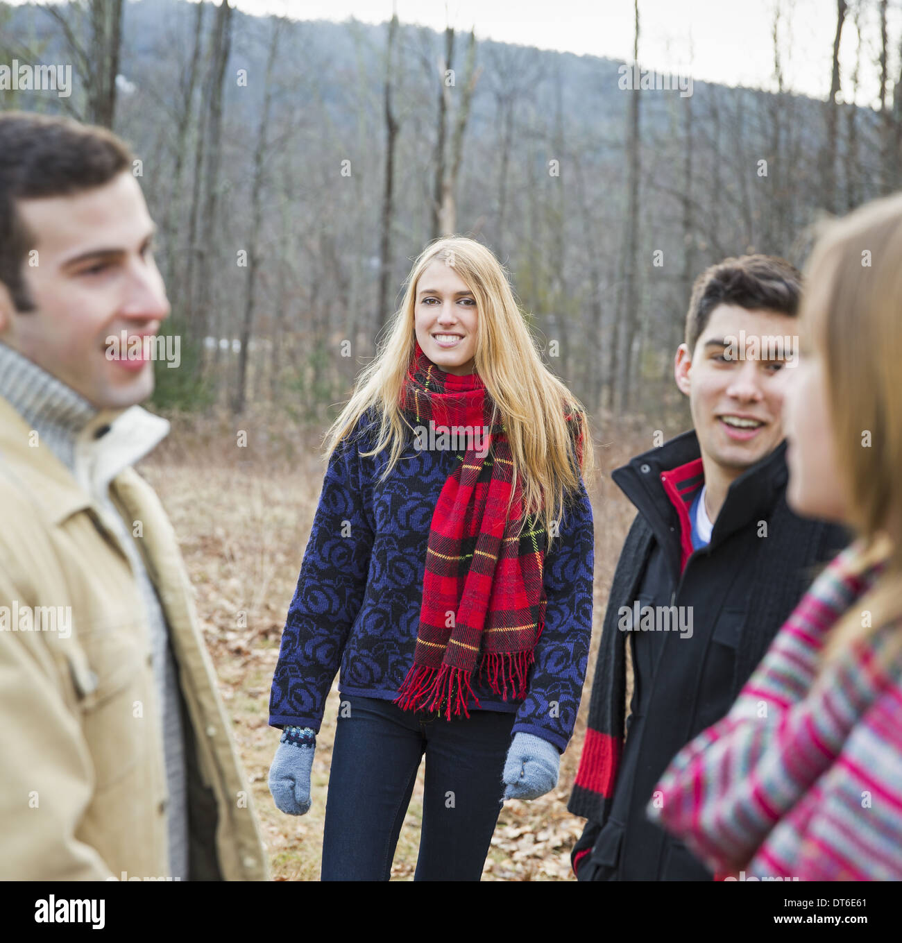 A group of four people outdoors on a winter day. Stock Photo