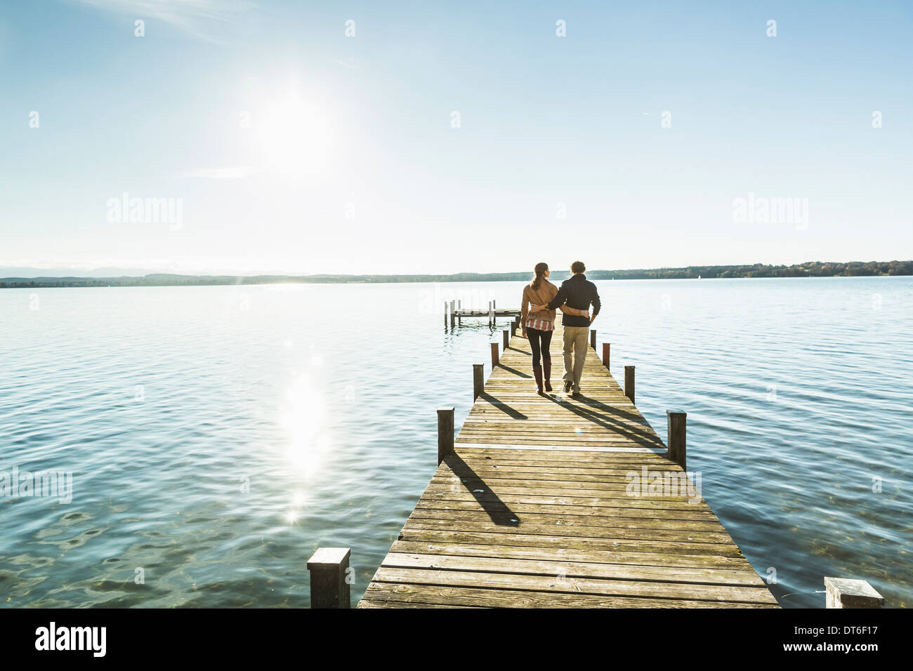 Couple on jetty, Lake Starnberg, Bavaria, Germany Stock Photo