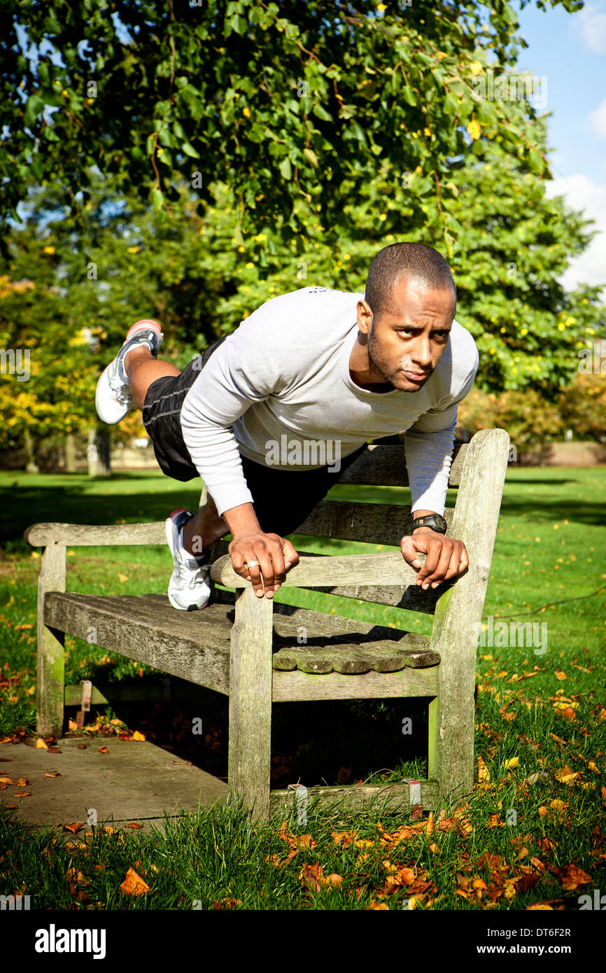Man In Plank Position On Park Bench Stock Photo 66526399 Alamy