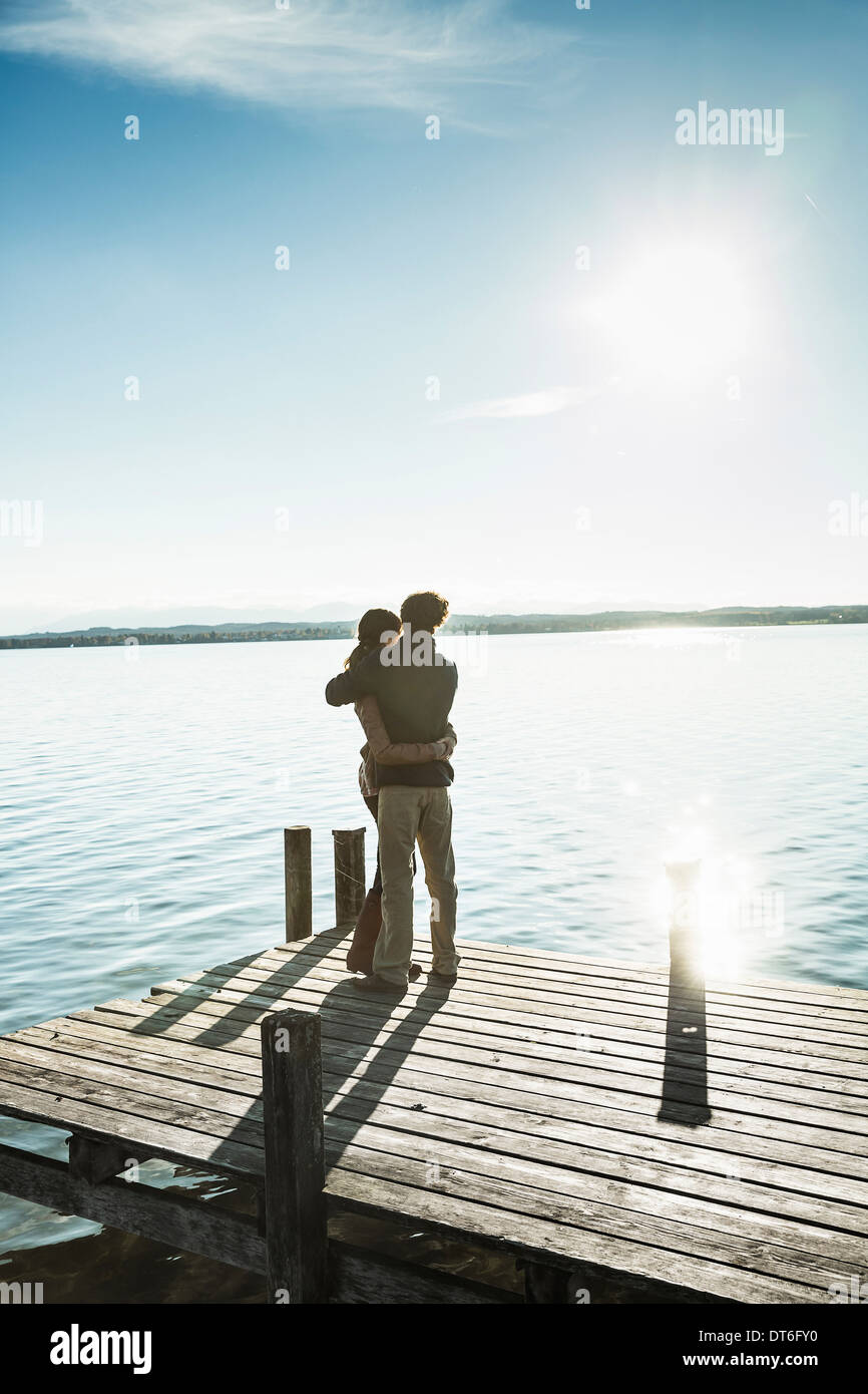 Couple on jetty, Lake Starnberg, Bavaria, Germany Stock Photo