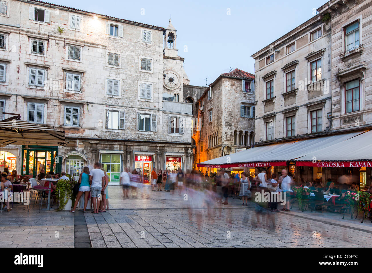 Place in the city center with restaurants and terraces filled with people having dinner Stock Photo