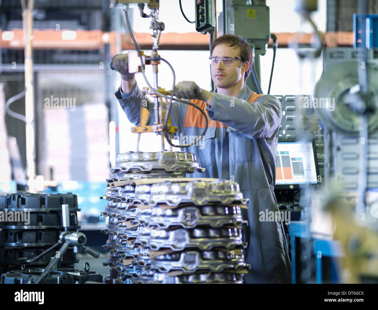 Worker on production line in industrial clutch factory Stock Photo