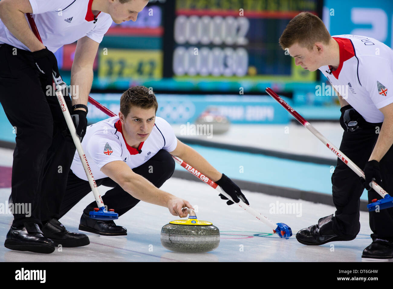 Sochi, Krasnodar Krai, Russia. 10th Feb, 2014. Great Britain's Scott ANDREWS delivers a stone during the Men's Curling round robin match between Great Britain and Sweden at the Ice Cube Curling Centre - XXII Olympic Winter Game Credit:  Action Plus Sports/Alamy Live News Stock Photo