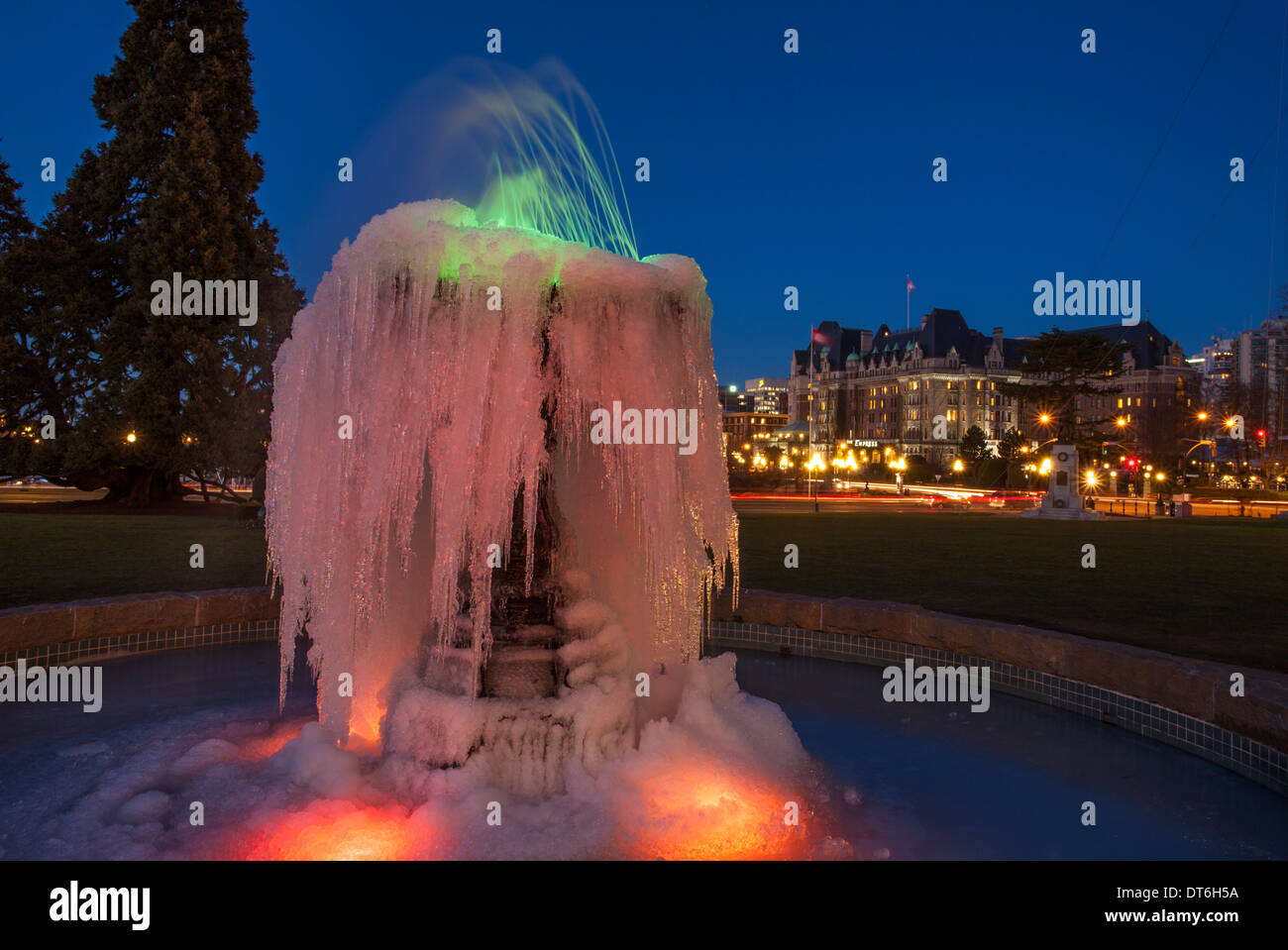 Frozen fountain and Fairmont Empress historic hotel  at twilight-Victoria, British Columbia, Canada. Stock Photo