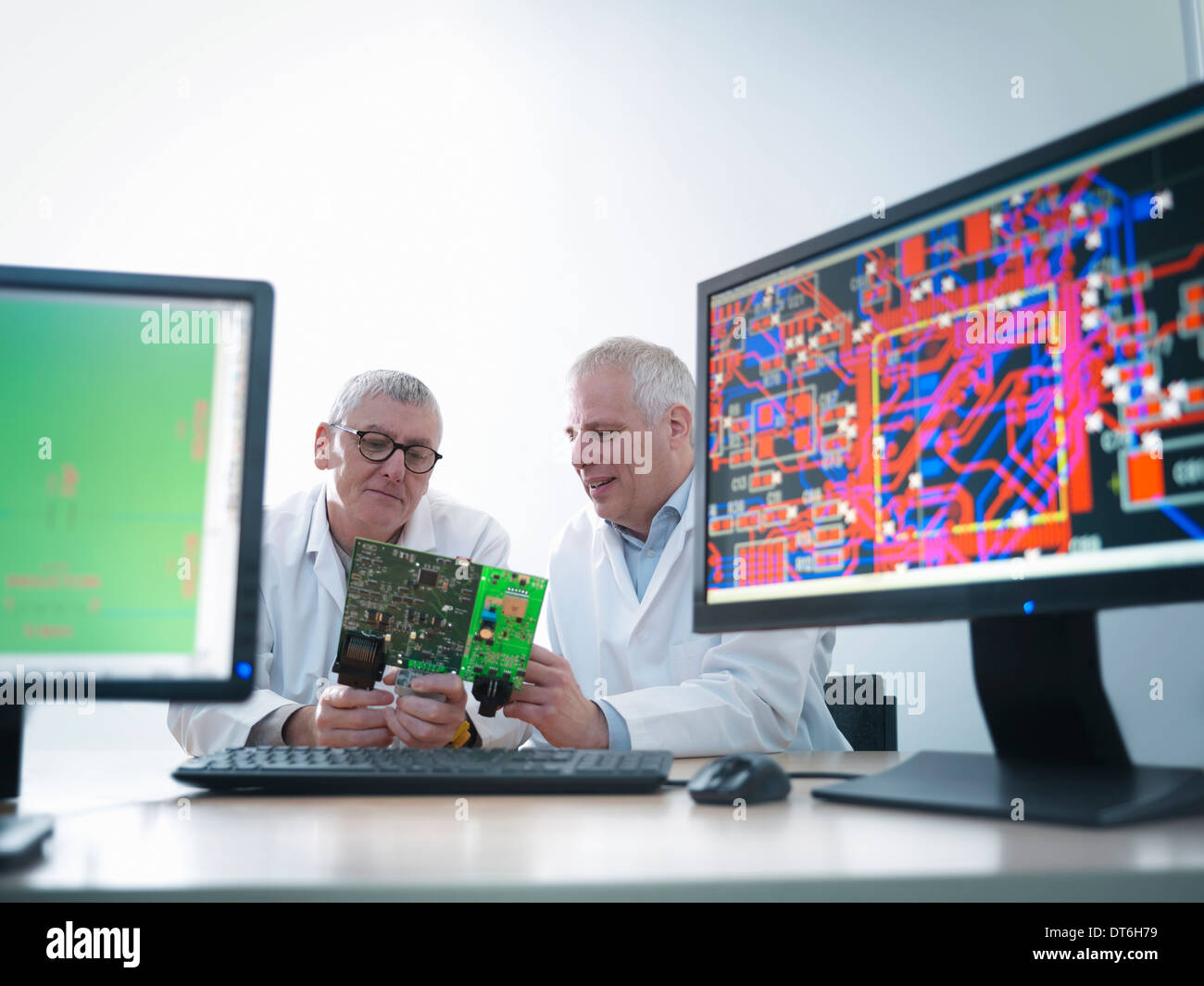 Engineers designing electronic circuitry for automotive use Stock Photo