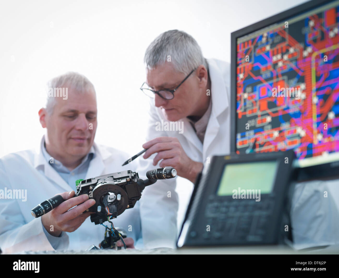 Engineers designing electronic circuitry for automotive use Stock Photo