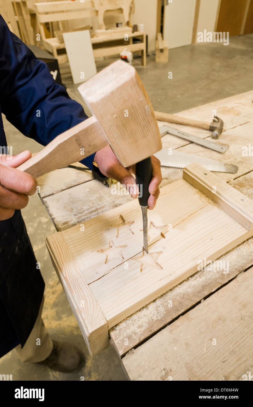 Man working in carpentry / woodwork workshop Stock Photo