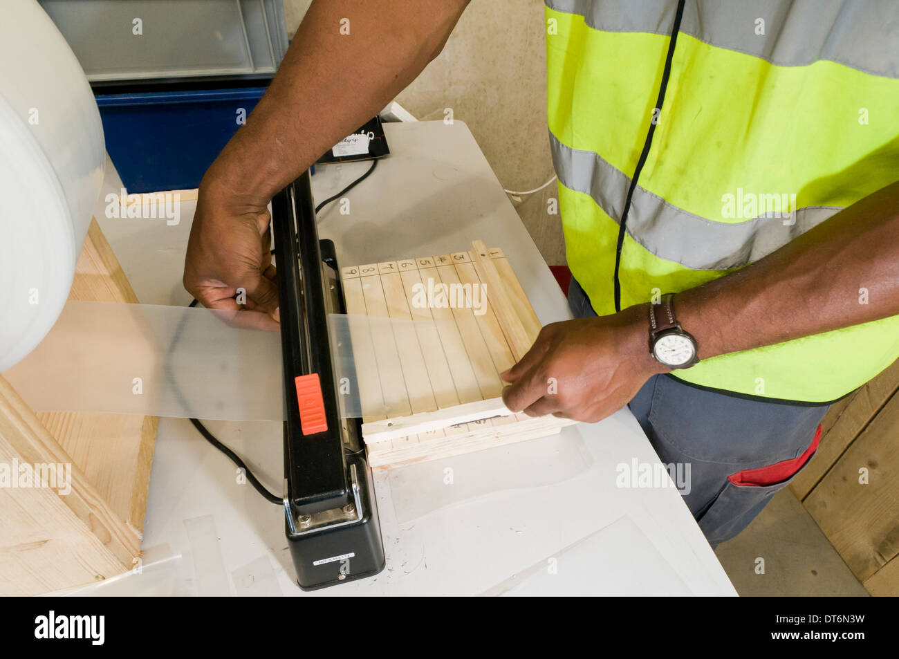 Afro Caribbean man packing goods Stock Photo