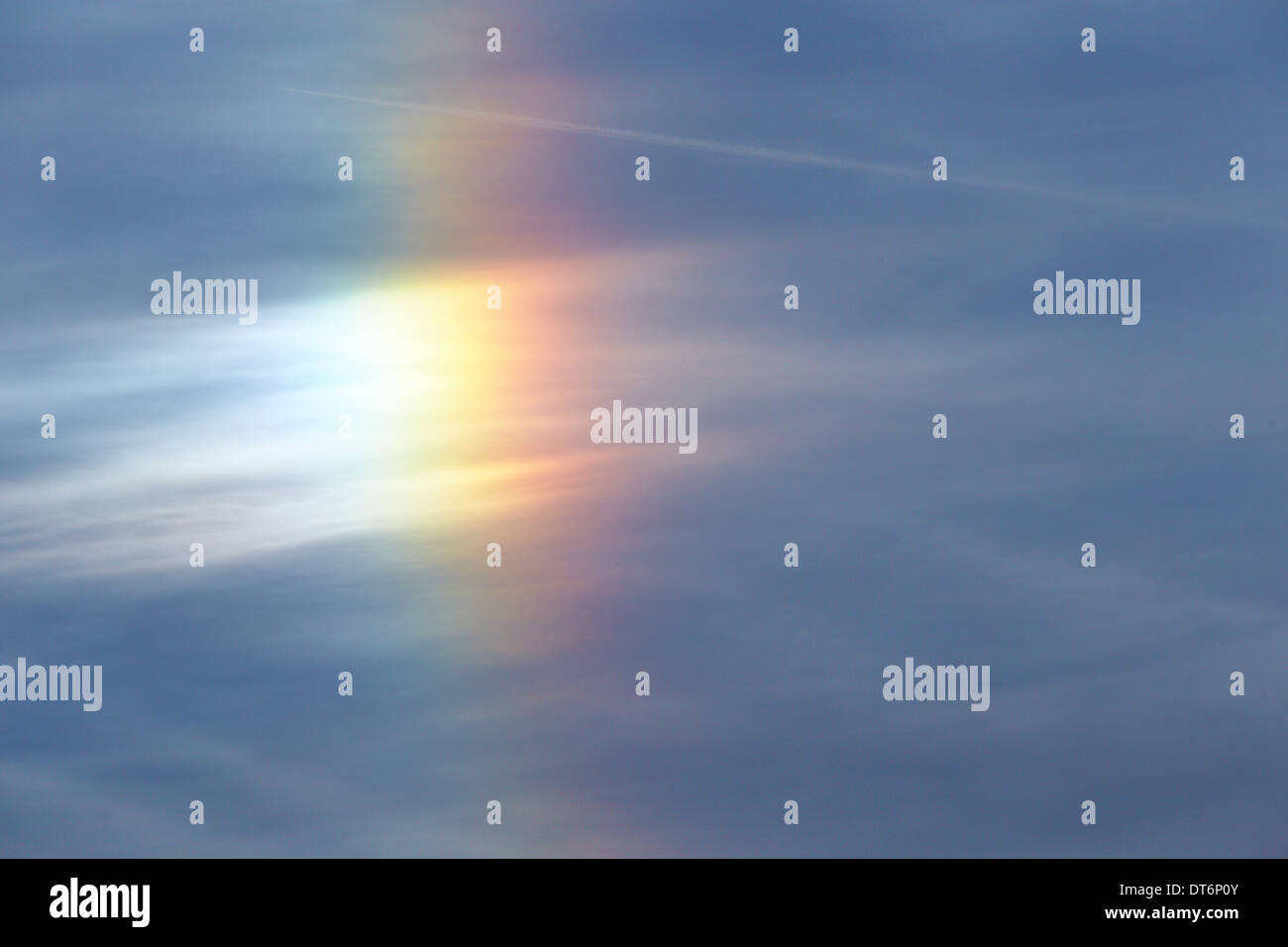Sun dogs, or parhelion, formed by small ice crystals in the upper atmosphere Stock Photo