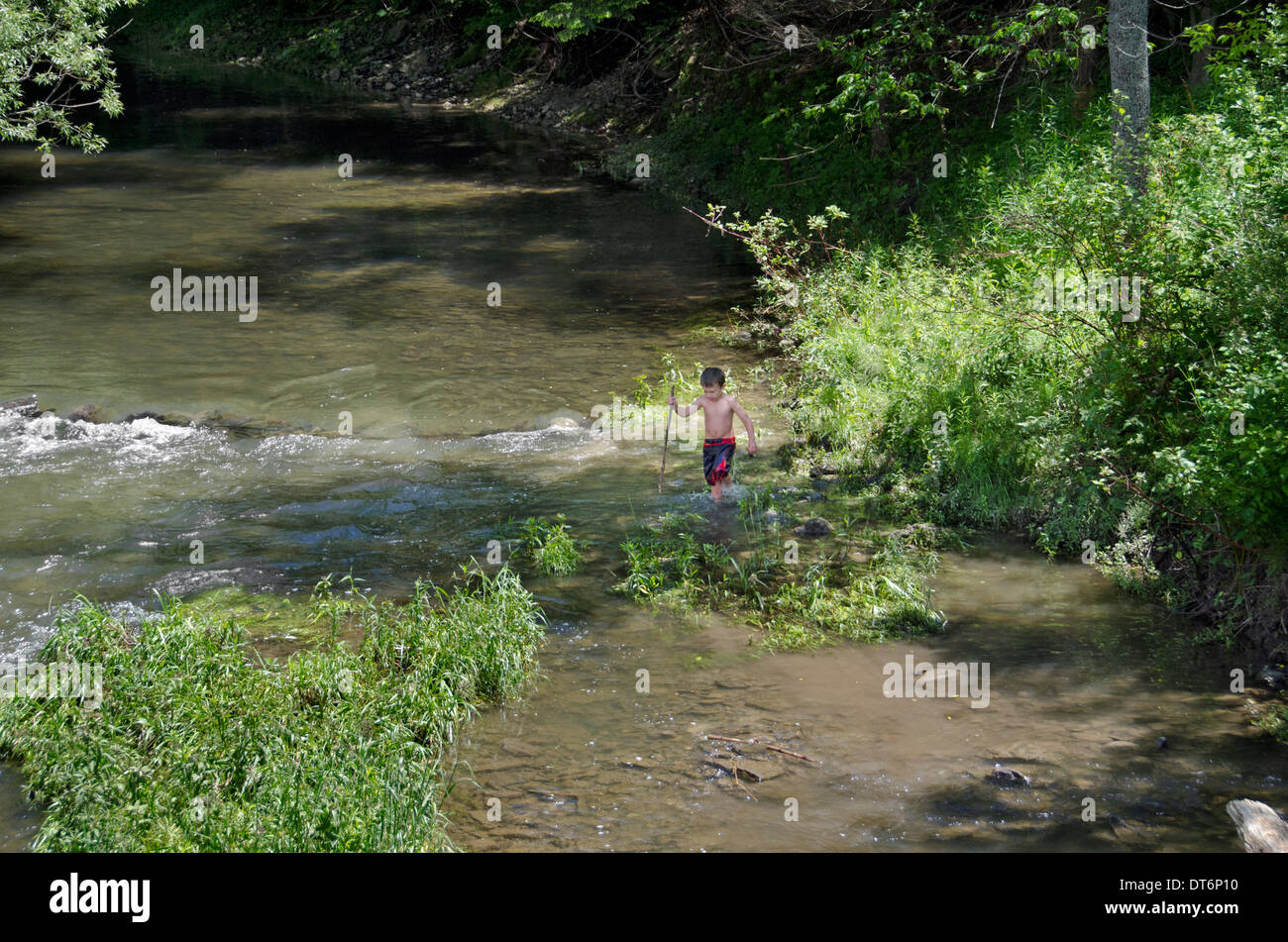 Boy playing in a river hi-res stock photography and images - Alamy