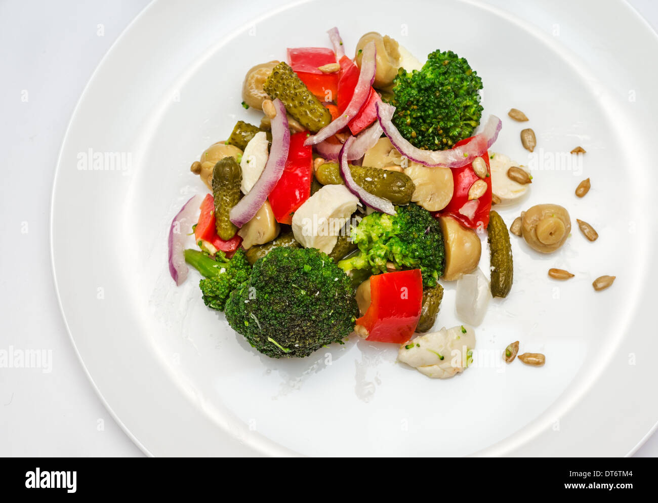 Broccoli salad with bell peppers, pickled cucumber, mushrooms and