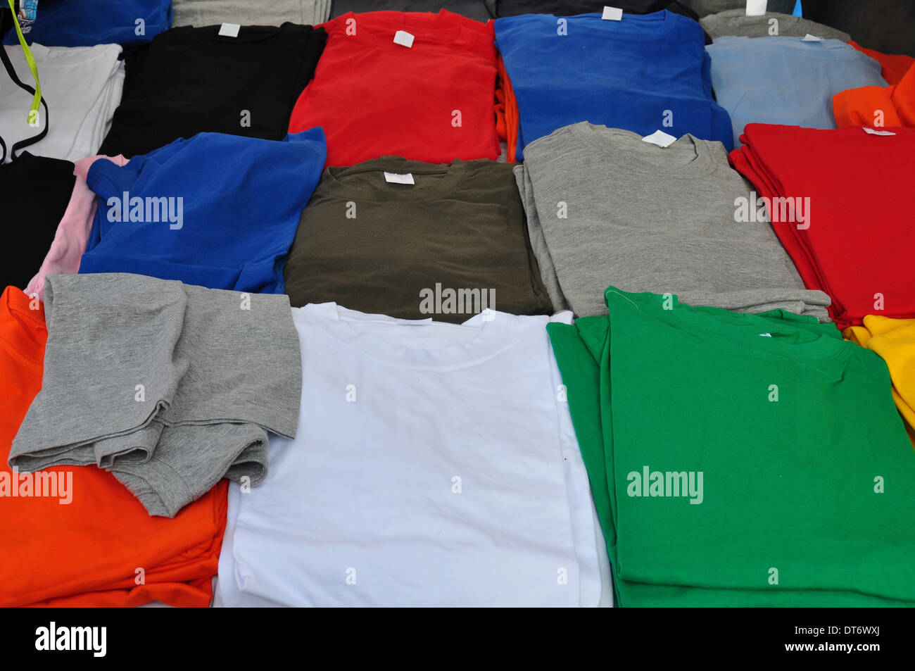 Colorful short sleeve t-shirts background. Casual summer clothes. Stock Photo