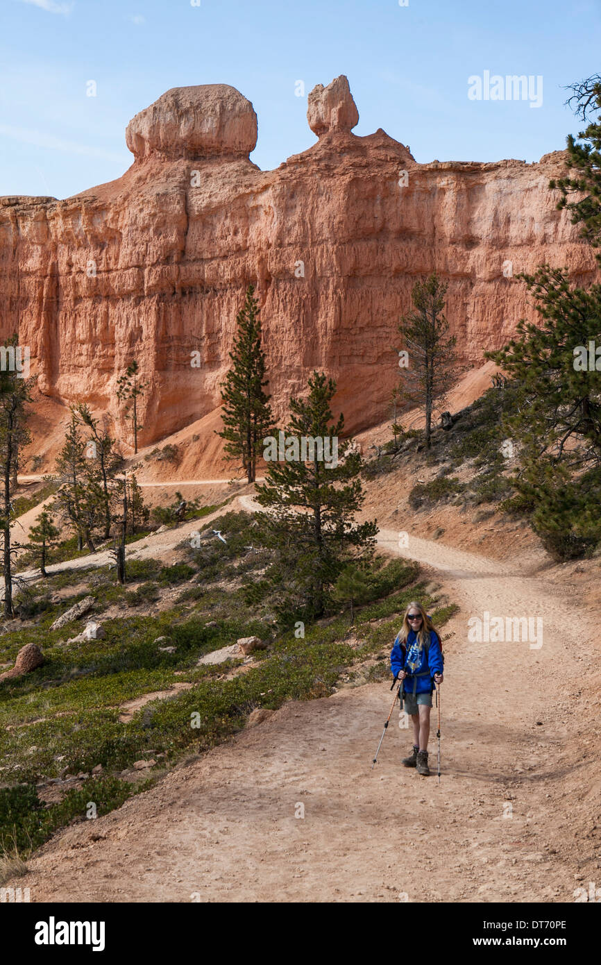 A hiker ascends the Devil's Garden Trail in Bryce Canyon National Park, Utah. Stock Photo