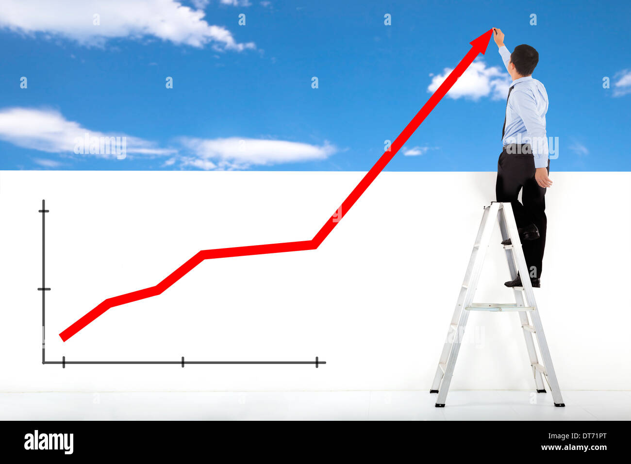businessman standing on ladder drawing global diagrams with sky and cloud Stock Photo