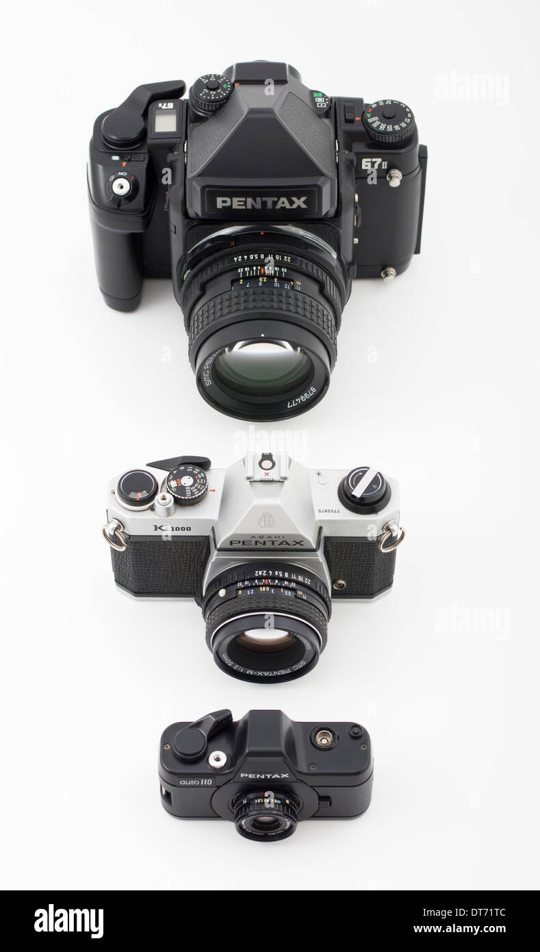 Pentax film SLR cameras in different film formats. 67II medium format, K1000 35mm, Auto110 110 film Stock Photo