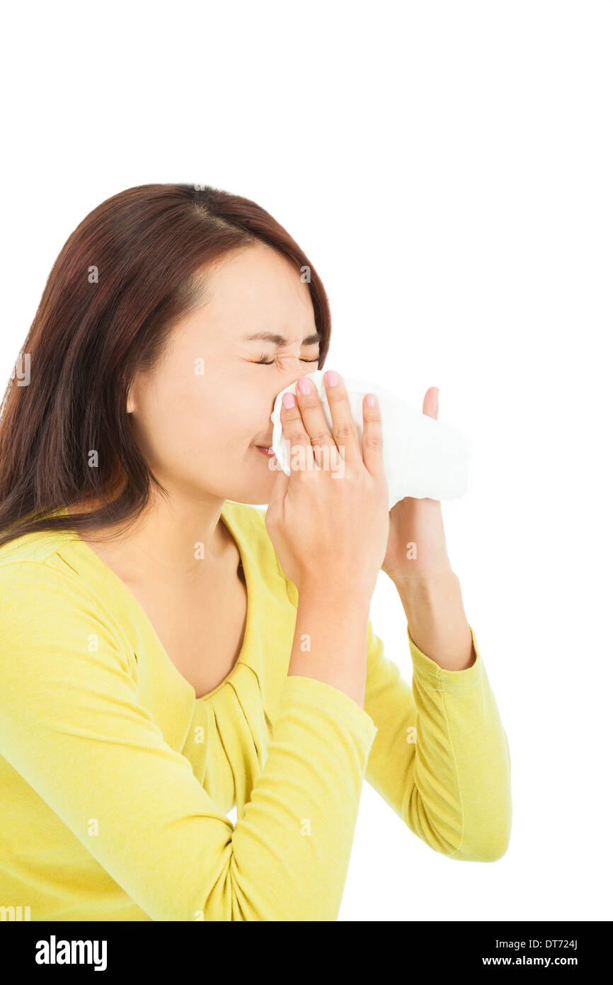 young woman using a tissue and blowing nose on white background Stock ...