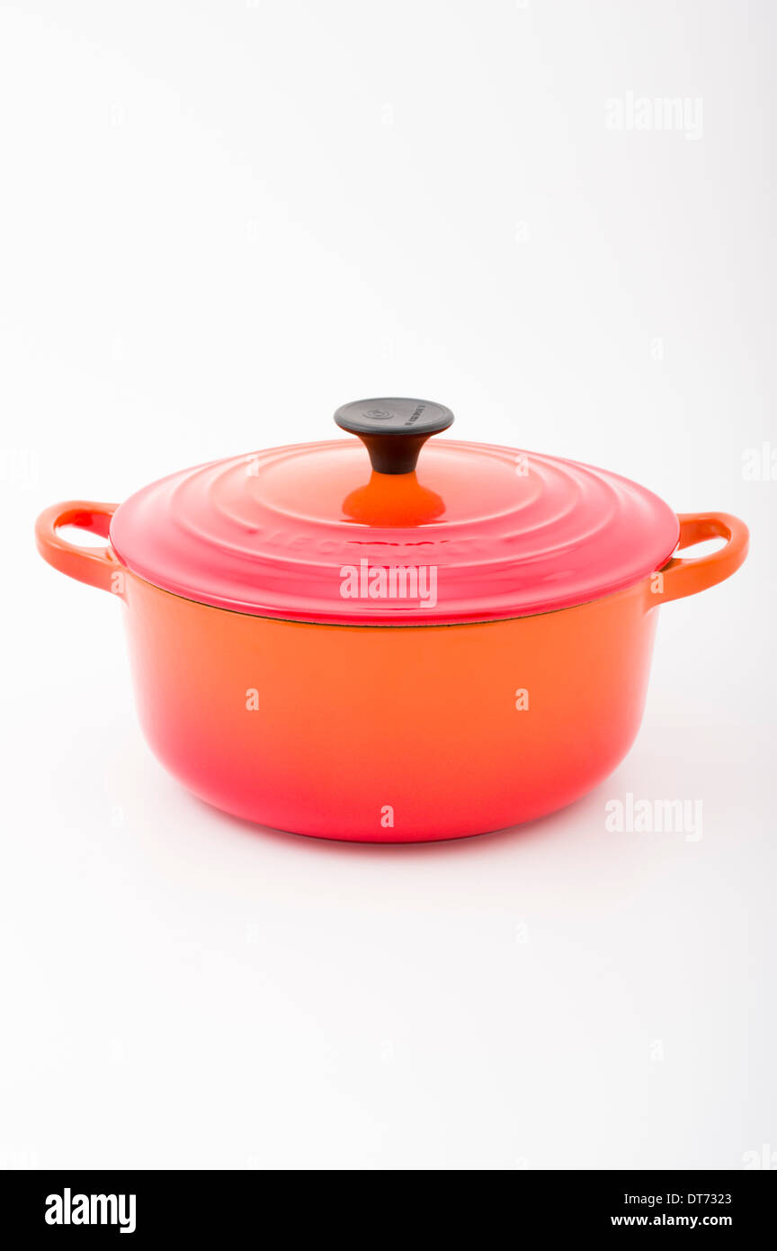 Le Creuset cast iron cast-iron French cookware with orange enamel. French oven / Casserole dish Stock Photo