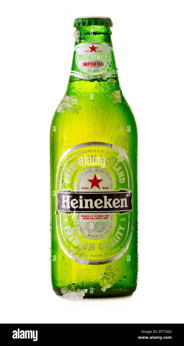 A bottle of cold Heineken Beer with condensation and ice on in Stock Photo
