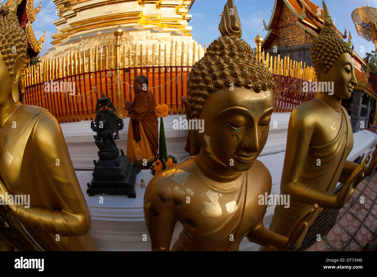 Three Golden Buddha statues and a monk, Wat Phra That Doi Suthep ...
