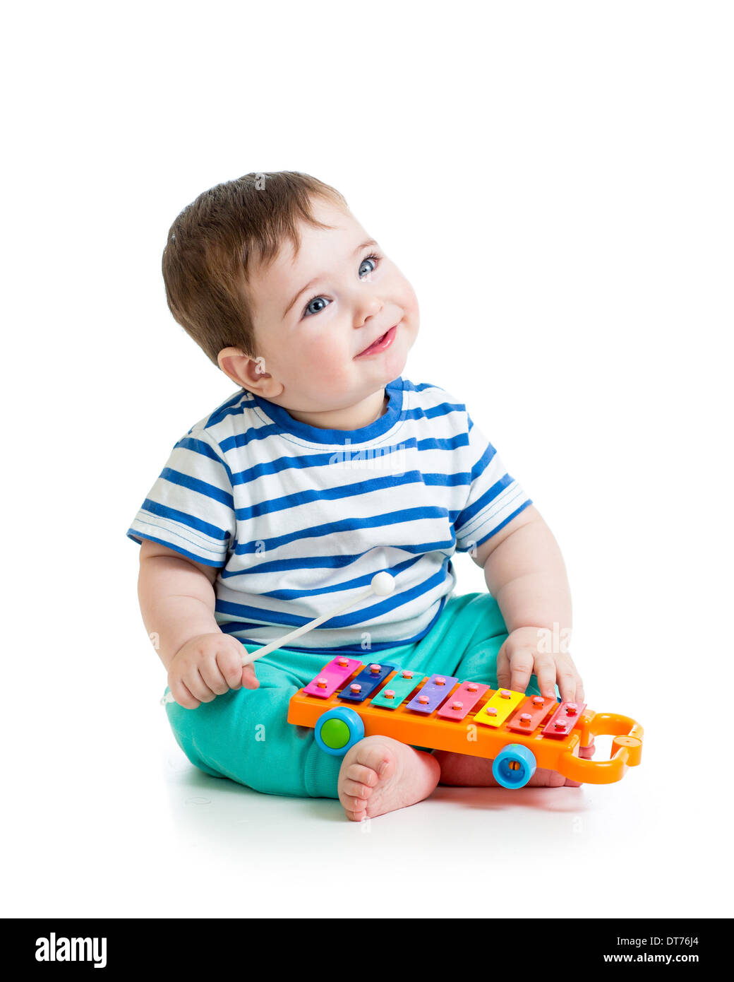 Nice baby playing with musical toys Stock Photo