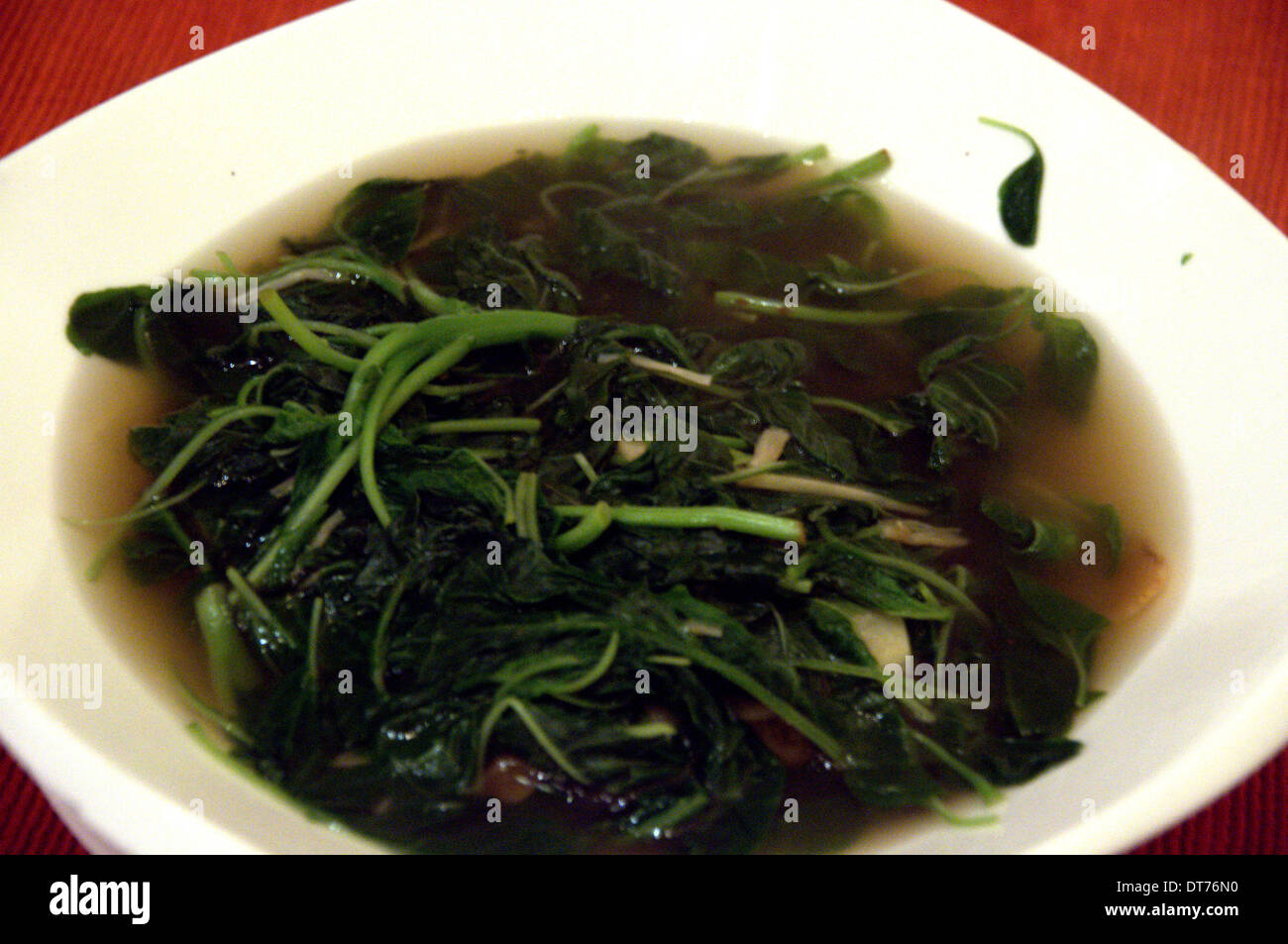 Spinach in soup Stock Photo - Alamy