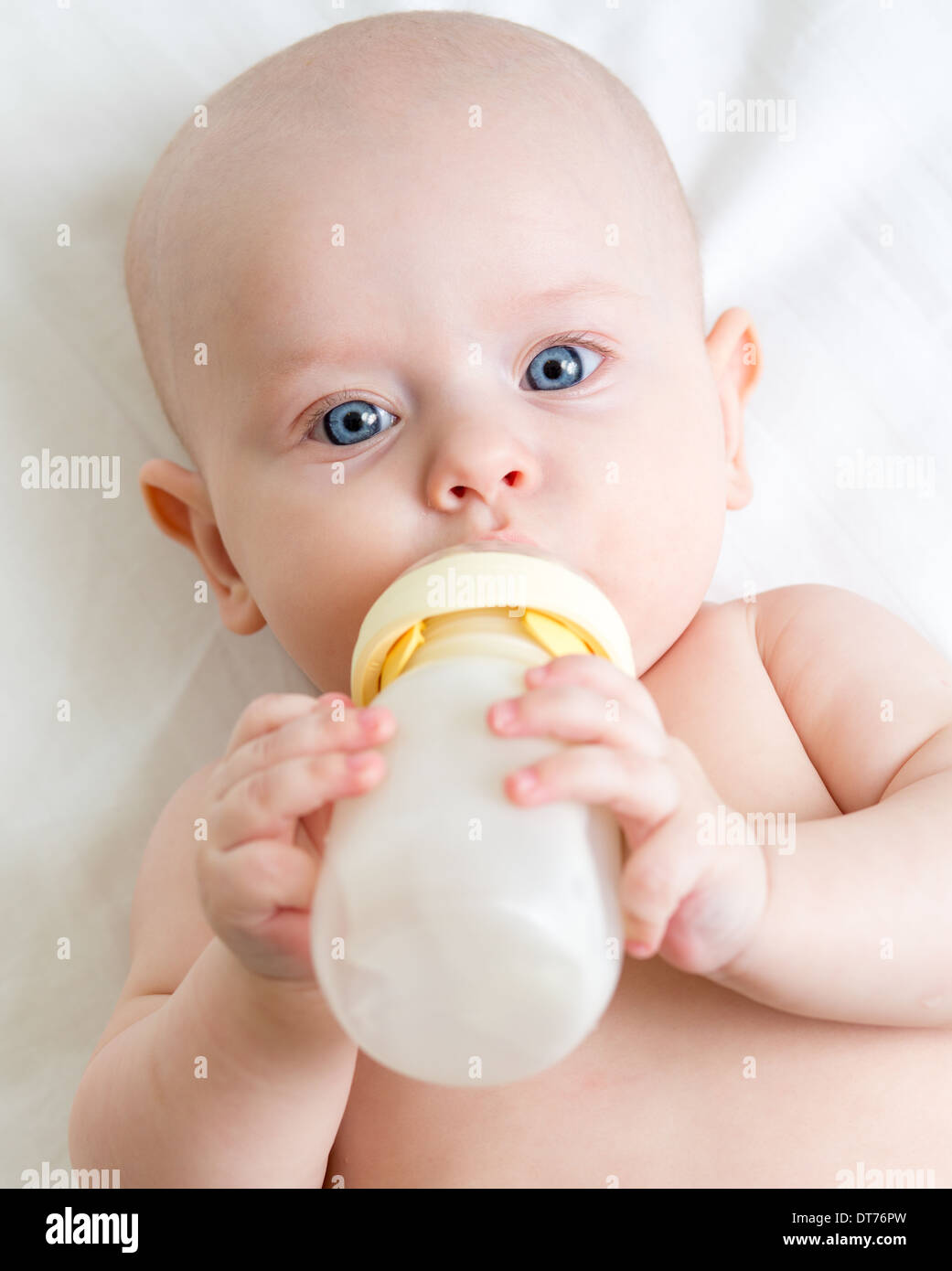 Pretty baby girl drinking milk from bottle Stock Photo Alamy